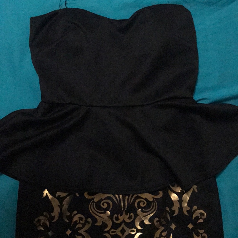 Strapless black mini dress with gold accents